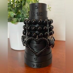 Bracelet Has 3 Stretchy Strands Of Black Beads And Dangling Charms. NWT